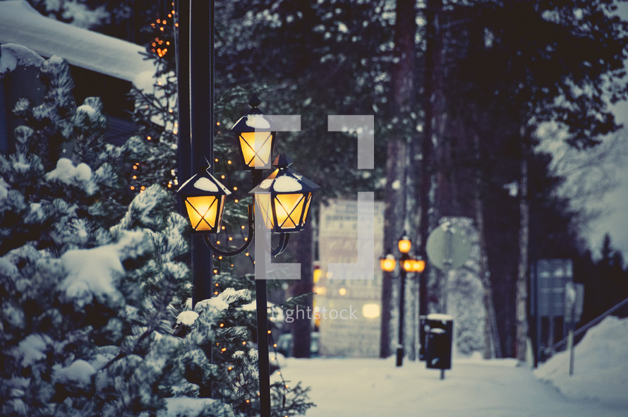 snow on street lamps 