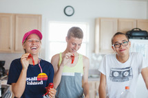 teens with candy in a kitchen 