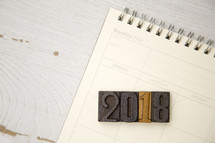 wood stamps 2018 on a calendar 