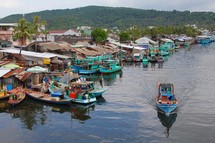 boats on a channel in a fishing village 