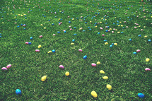 Easter eggs spread out on a lawn 
