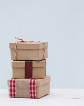 stacked brown paper gifts 