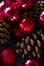 Red Christmas balls and pine cones