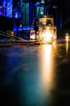 lightbulb in a jar on a stage