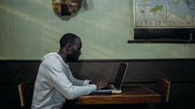 man working at a laptop computer 