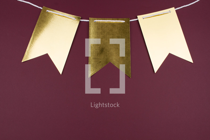 blank gold banner on maroon 