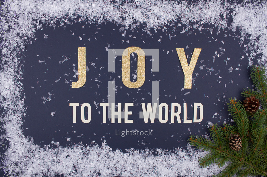 Joy to the world with snow border and green pine 