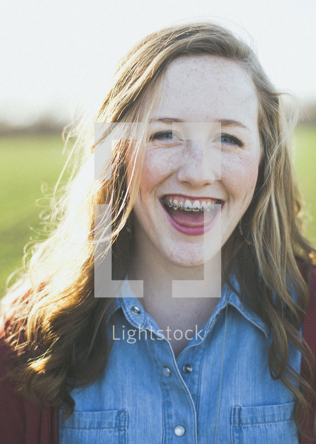 smiling teen girl with braces