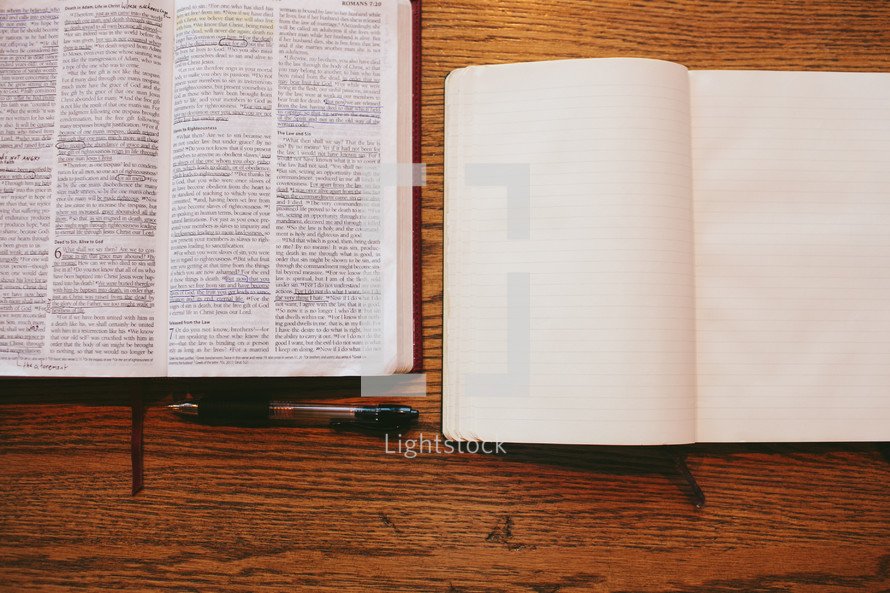 open Bible, open journal, and pen 