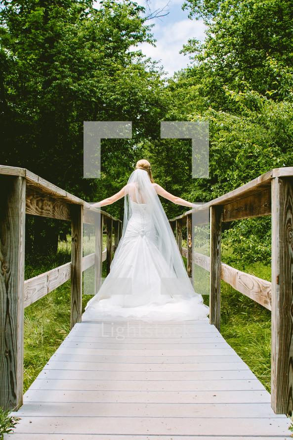 bride on a foot bridge 