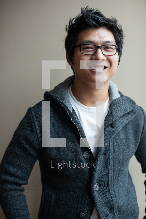 portrait of an Asian man with glasses 