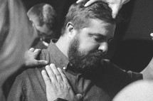 man being prayed for