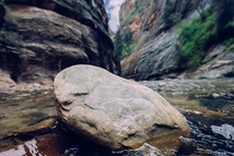 rocks and cliffs near a stream 