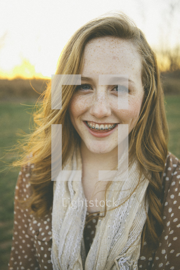 smiling teen girl with braces