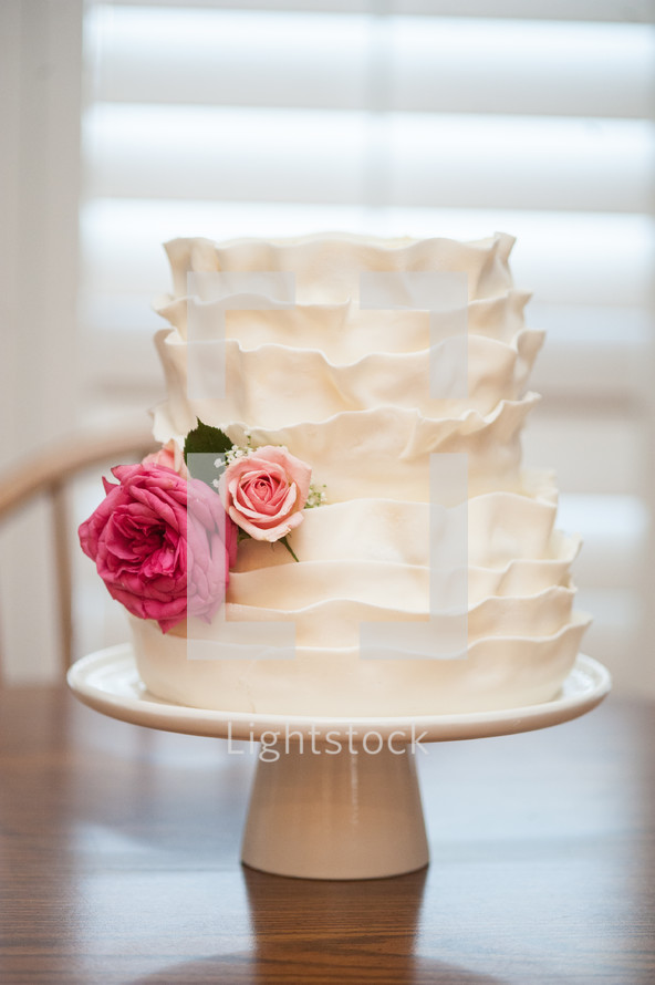 wedding cake on a cake stand 