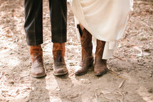 bride and groom wearing cowboy boots 