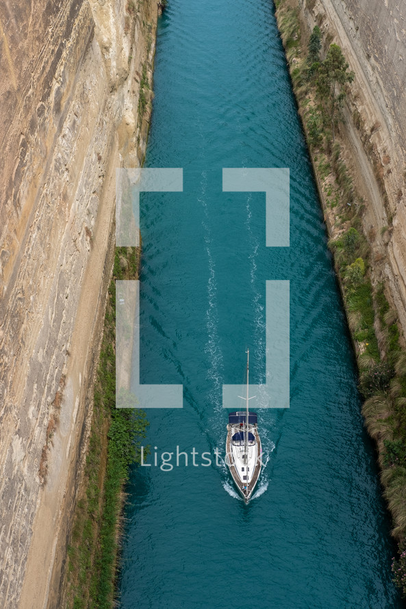 boat passing through a narrow canal 