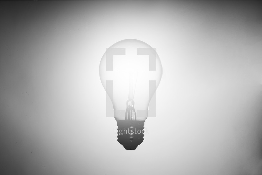 glowing lightbulb on white background