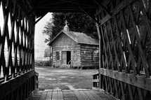 covered bridge and old log cabin chapel 