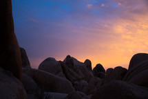 smooth rocks on a mountaintop at sunset 