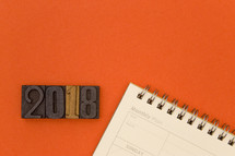 wood stamps with 2018 and a calendar 