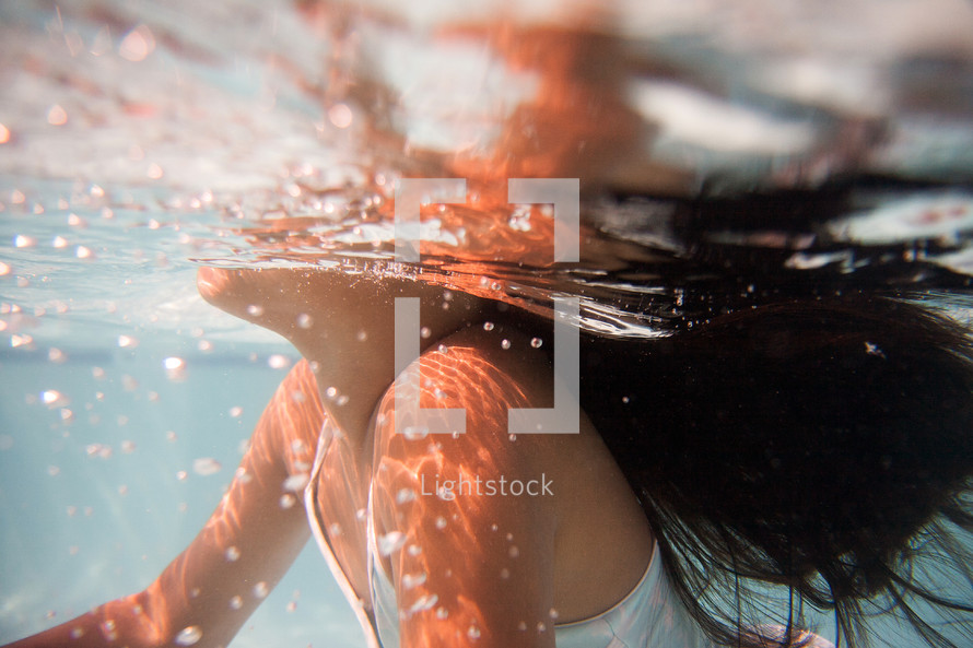 a girl child swimming 