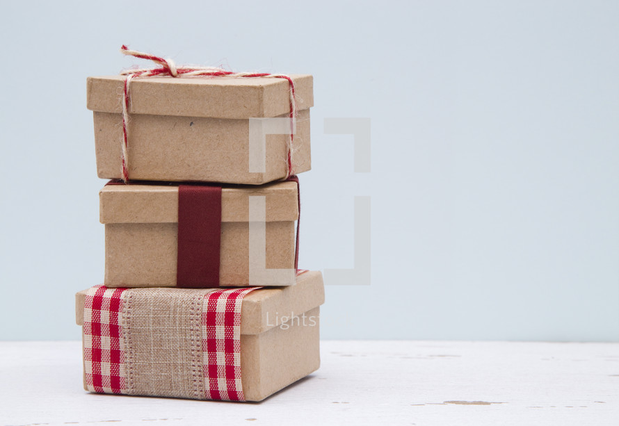 stacked brown paper gifts 