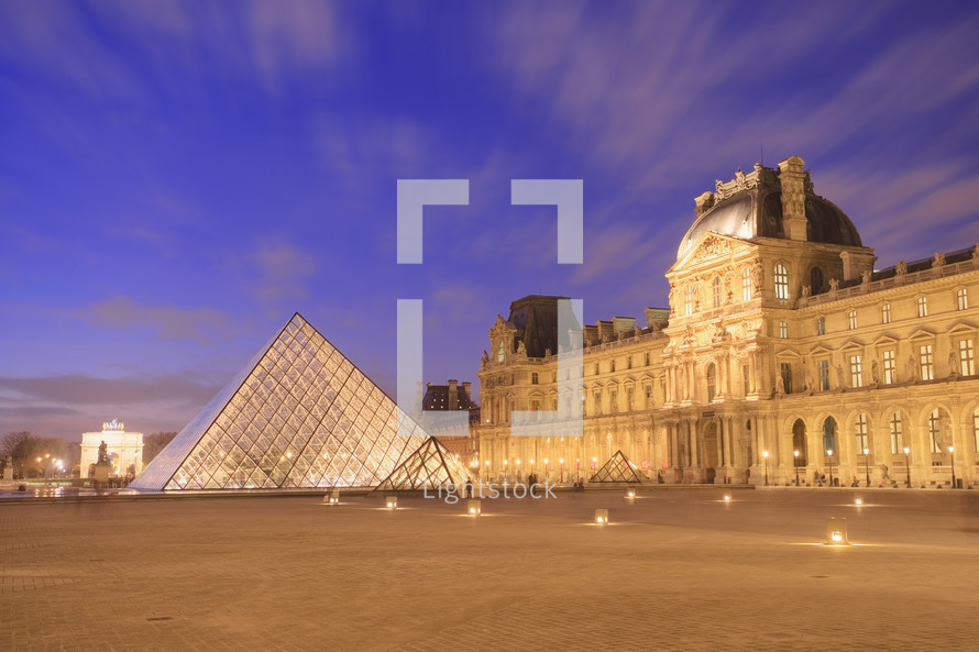 The Louvre Pyramid at dusk. Paris, France.- editorial use only