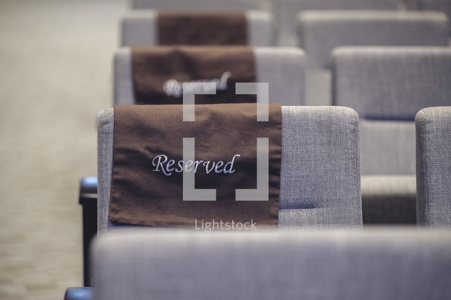 Reserved seating cover on a chair at church.