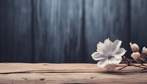 Wooden table with spring flowers on dark wooden background. Toned.