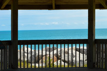 view of the ocean from a porch 