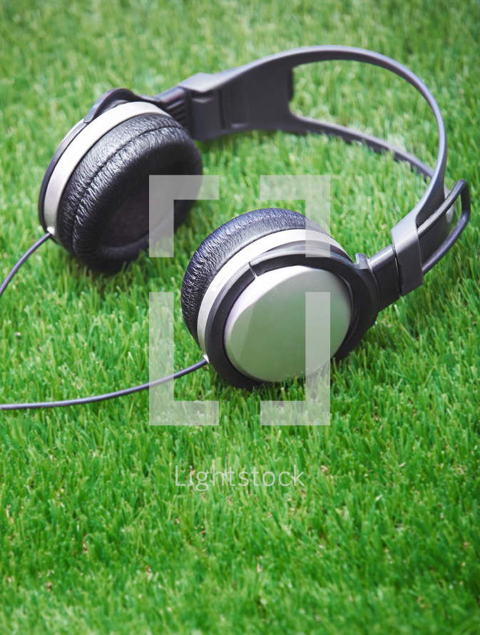 headphones on grass