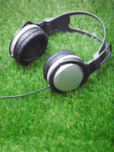 headphones on grass