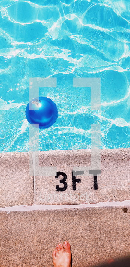 ball floating in a pool 