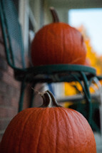 pumpkins on a front porch 