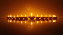 Diwali Diyas, Row of Lit Clay Lamps