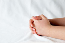 child's praying hands 
