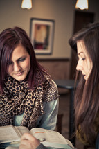 two women discussing scripture at a Bible study