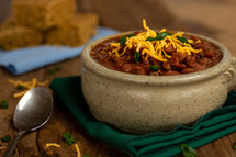 a bowl of bean chili and cornbread