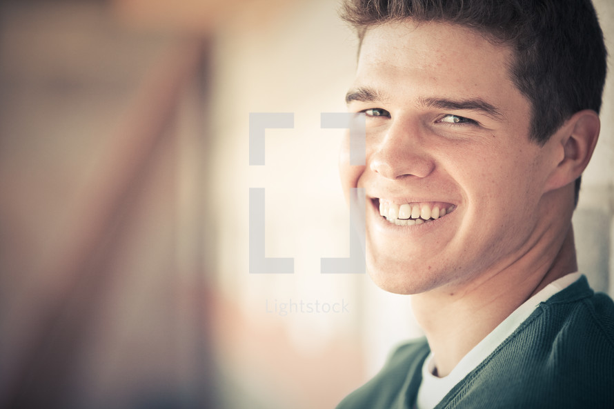 Smiling portrait of a handsome teenage boy. 
