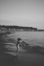 child playing on a beach 