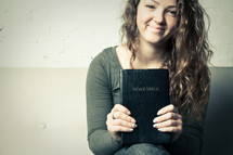 teen girl holding a Bible