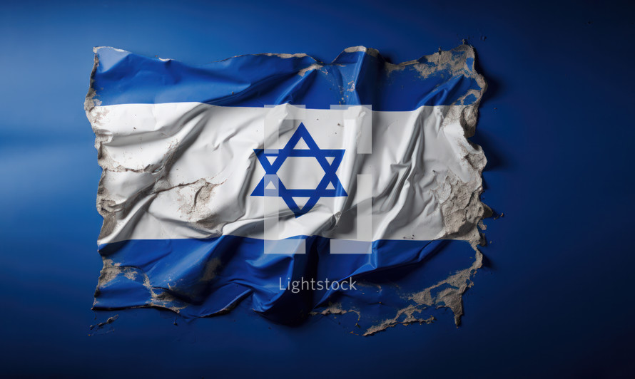 The flag of Israel was broken down and ripped apart against a blue backdrop. The star of David in the middle