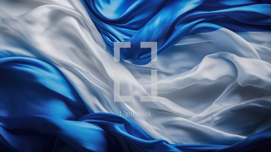 White and blue fabric is lit in a studio environment. 