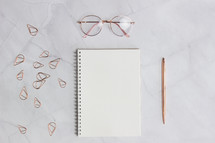 paper clips, notebook, pen 