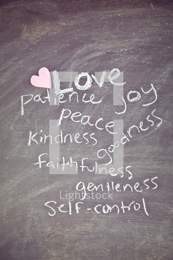 The Fruit of the Spirit - Love, Peace, Kindness, Faithfulness, goodness, gentleness, joy, patience, and self-control written on a chalkboard 