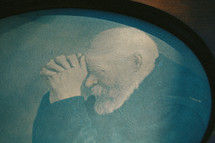 painting of a man in prayer