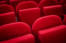 plush red seats in a cinema auditorium