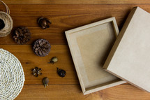 wrapped brown paper gift box and pine cones 
