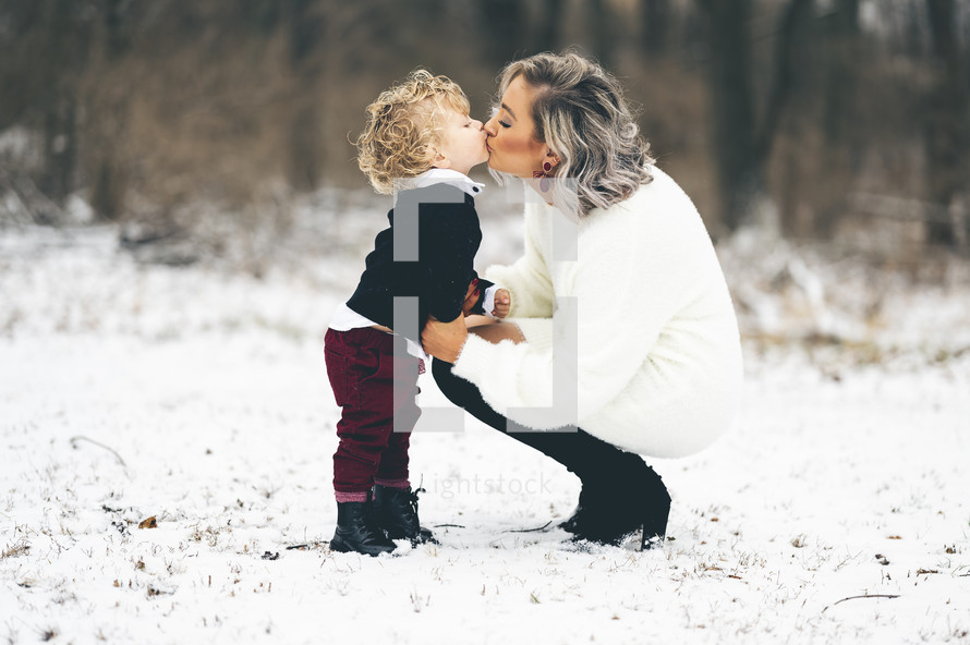 mother and son portrait in the snow 